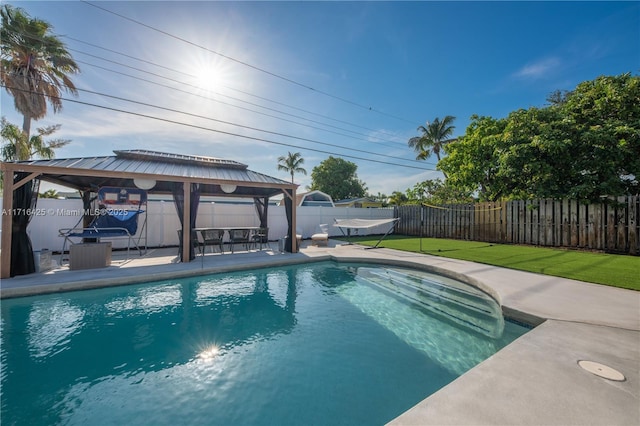 view of pool featuring a gazebo, a patio area, and a yard