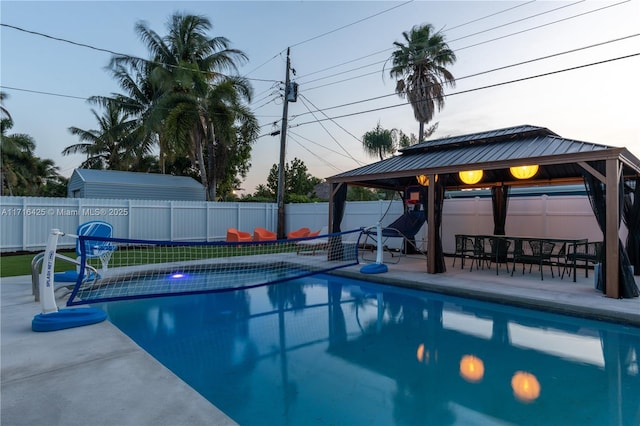 view of swimming pool featuring a gazebo and a patio