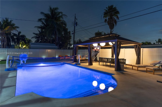 view of swimming pool with a gazebo and a patio area