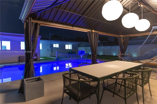 view of swimming pool featuring a gazebo and a patio area