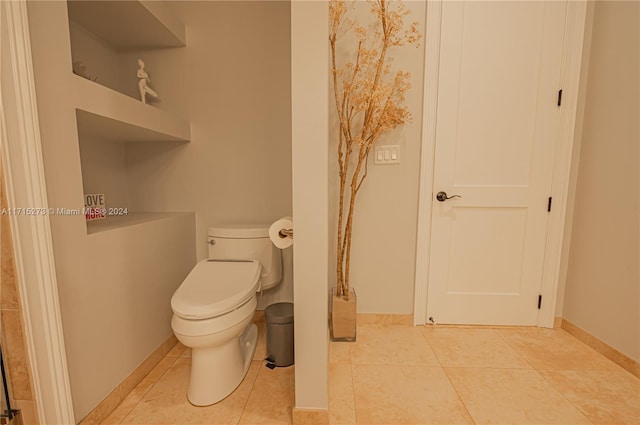 bathroom featuring tile patterned flooring and toilet