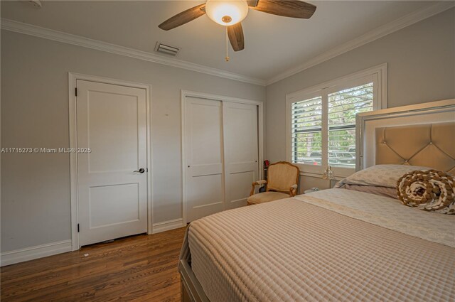 bedroom with multiple windows, crown molding, ceiling fan, and dark wood-type flooring