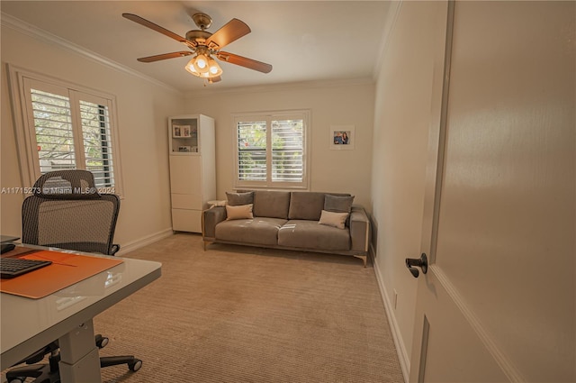 home office featuring light carpet, crown molding, and ceiling fan