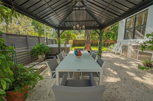 view of patio / terrace with area for grilling and sink