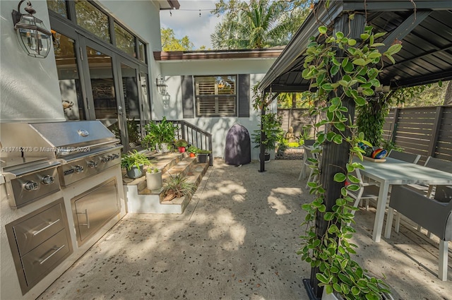 view of patio / terrace with a gazebo and grilling area