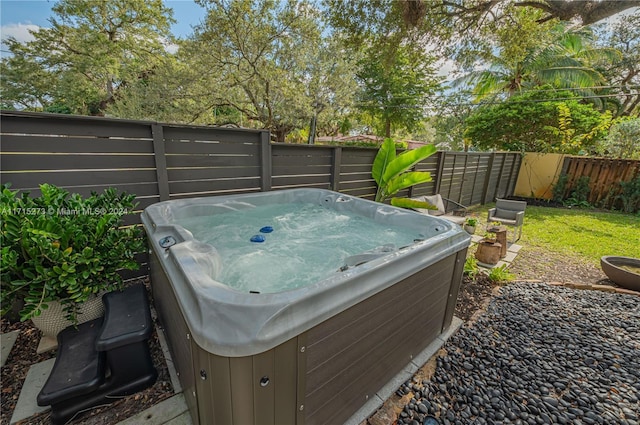 view of yard with a hot tub