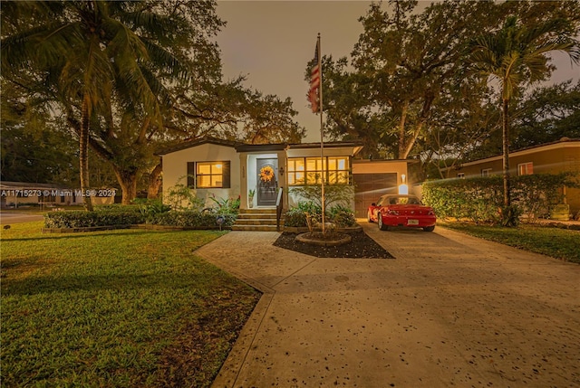 view of front of property with a yard