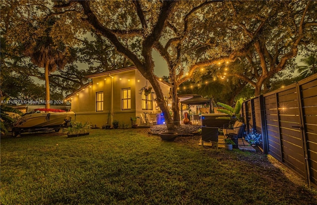 view of side of home featuring a lawn