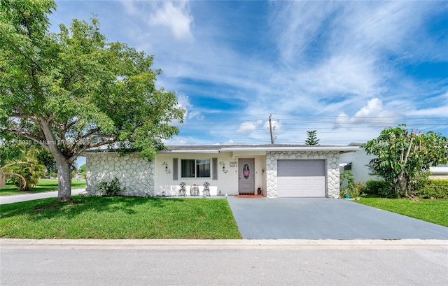 ranch-style home with a front yard and a garage