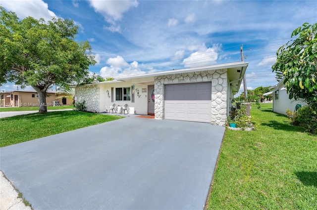 single story home featuring a front lawn and a garage