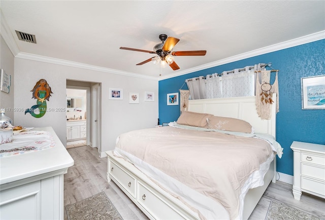 bedroom featuring ensuite bath, ceiling fan, light hardwood / wood-style floors, and ornamental molding