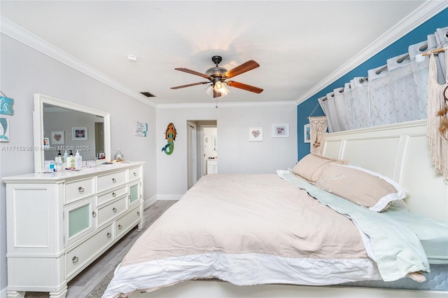 bedroom with dark hardwood / wood-style flooring, ceiling fan, and crown molding