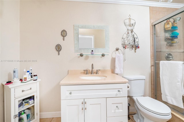 bathroom featuring vanity, toilet, and a shower with door