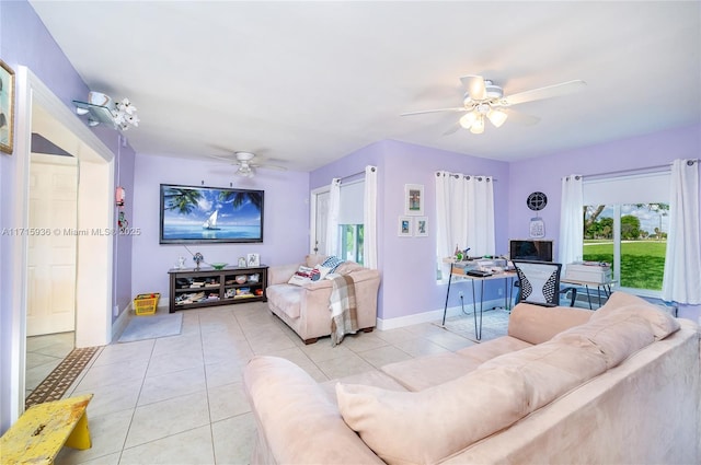 living room featuring ceiling fan and light tile patterned floors