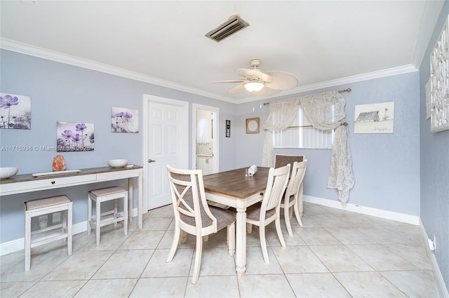 dining area with light tile patterned floors, ceiling fan, and ornamental molding