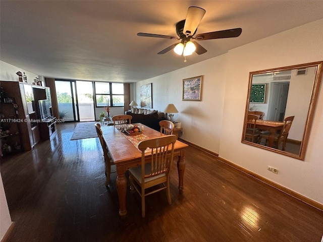 dining space featuring ceiling fan and dark hardwood / wood-style flooring