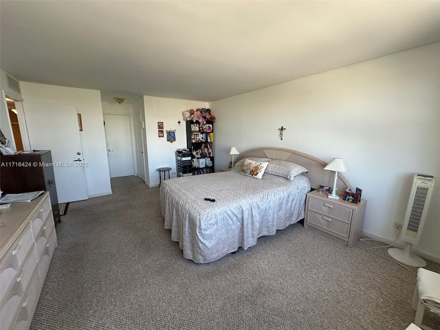 carpeted bedroom featuring heating unit