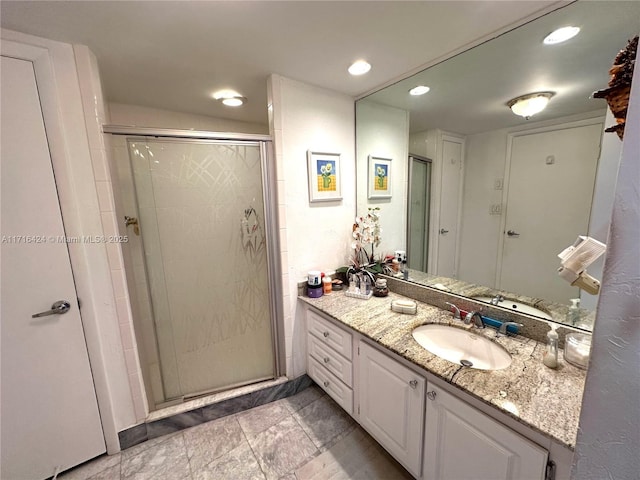 bathroom featuring vanity and walk in shower