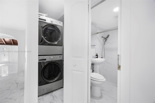 laundry room featuring stacked washing maching and dryer