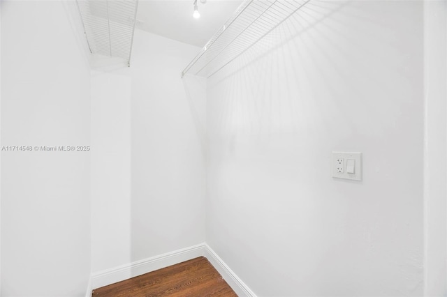 spacious closet featuring hardwood / wood-style flooring