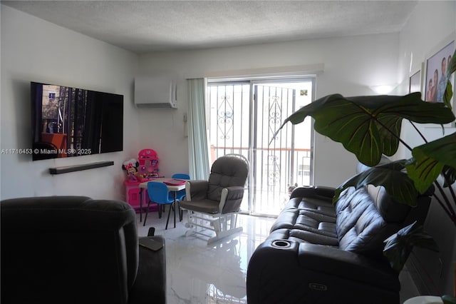 living room featuring a wall mounted air conditioner and a textured ceiling