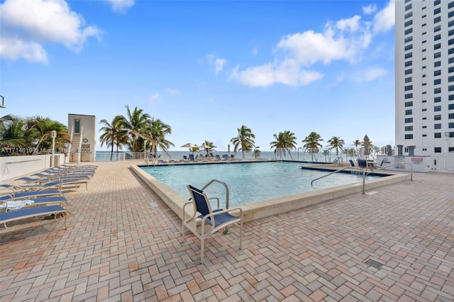 view of swimming pool featuring a patio area