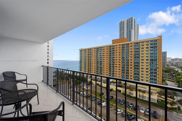 balcony featuring a water view