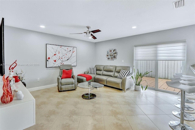 living area with tile patterned floors, visible vents, a ceiling fan, recessed lighting, and baseboards