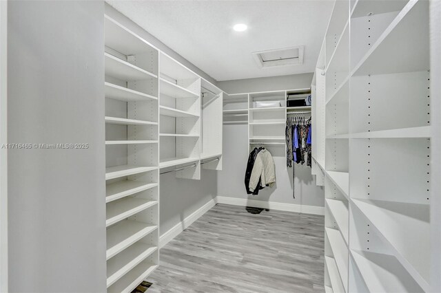 bathroom featuring vanity, a shower with door, tile patterned flooring, toilet, and tile walls