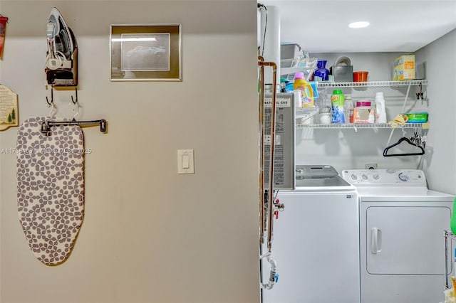 washroom with recessed lighting, independent washer and dryer, and laundry area