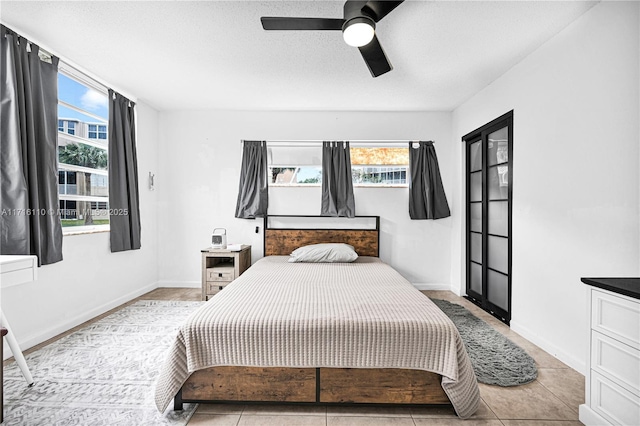 tiled bedroom with ceiling fan