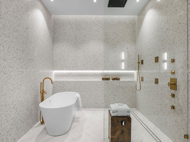 bathroom with vanity, a shower, and backsplash