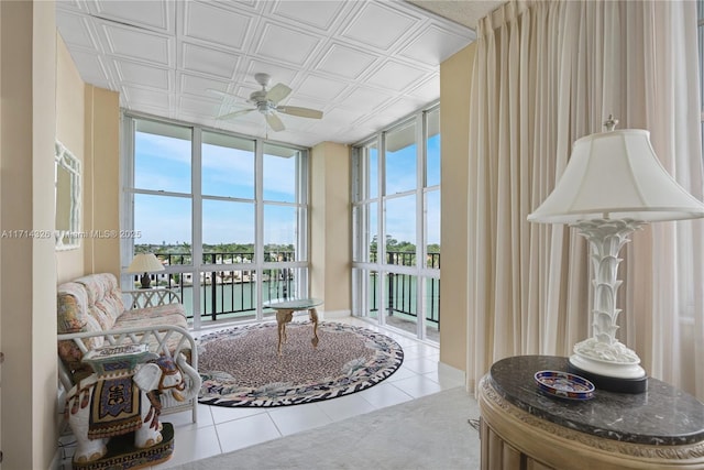 interior space featuring a water view and ceiling fan