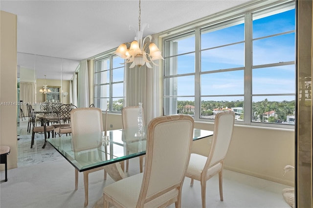 dining space featuring a notable chandelier