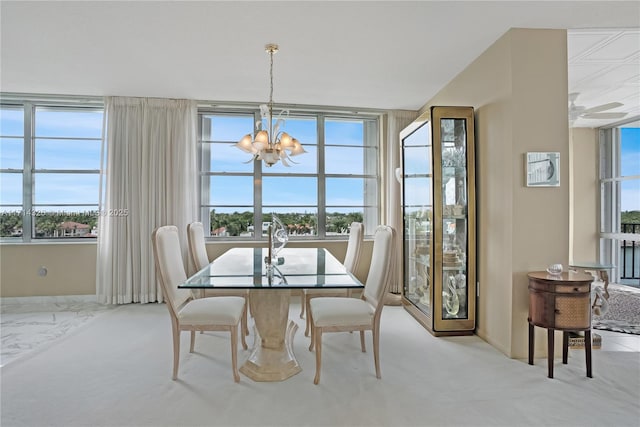 dining area with light carpet and a notable chandelier