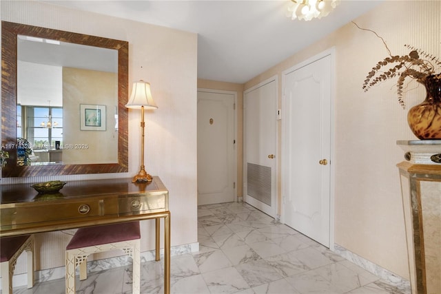 entryway with a notable chandelier