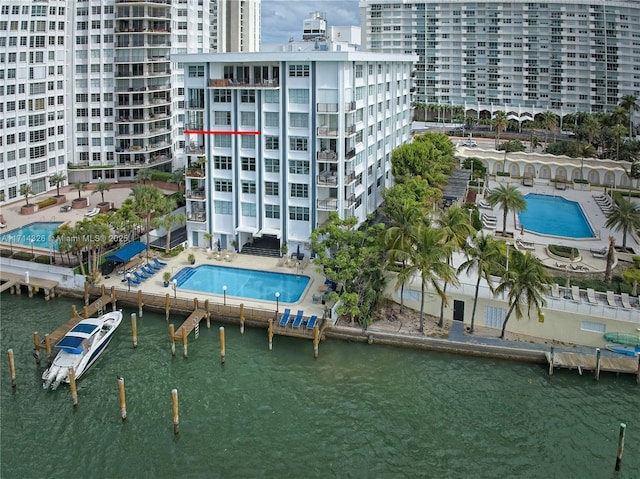 birds eye view of property with a water view