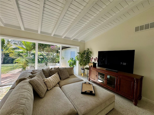 living room featuring vaulted ceiling with beams