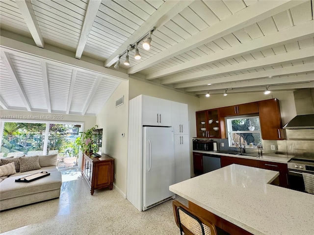 kitchen featuring white refrigerator, sink, wall chimney exhaust hood, decorative backsplash, and wall oven