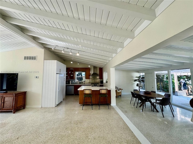 interior space with lofted ceiling with beams