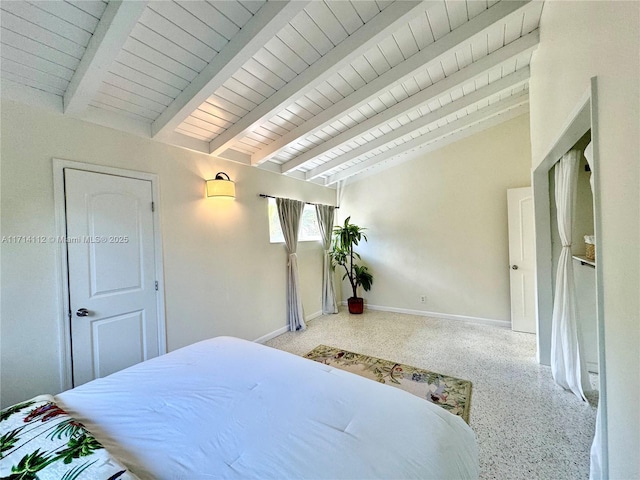 bedroom featuring vaulted ceiling with beams