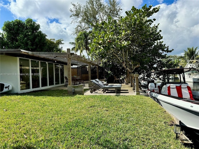 view of yard with a pergola and a patio