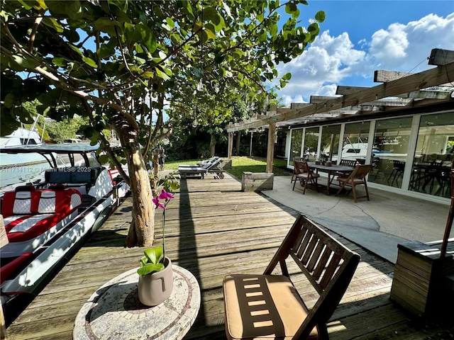 exterior space with a pergola and a wooden deck