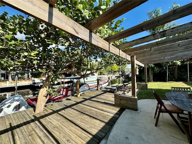 view of patio / terrace with a pergola and a dock