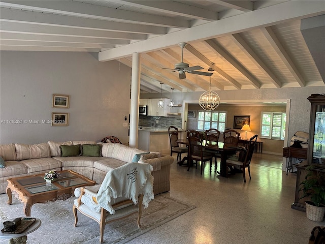 living room featuring vaulted ceiling with beams and ceiling fan with notable chandelier