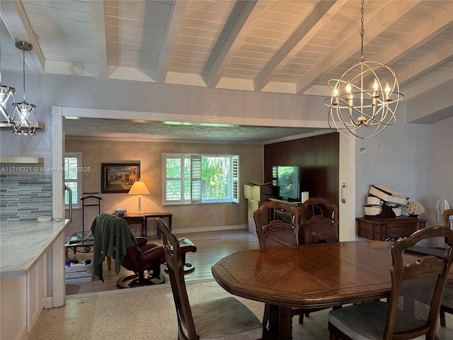 dining room with a notable chandelier, beam ceiling, and light hardwood / wood-style flooring