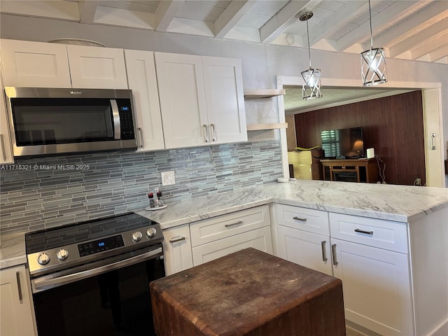 kitchen featuring pendant lighting, decorative backsplash, white cabinetry, and appliances with stainless steel finishes