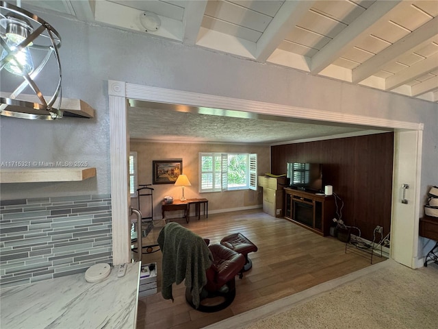 living room with beamed ceiling and hardwood / wood-style flooring