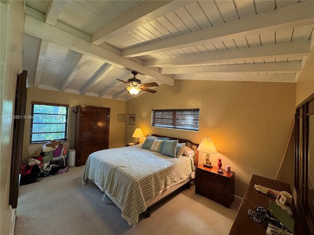 bedroom with ceiling fan, lofted ceiling with beams, and light colored carpet