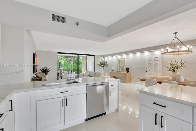 kitchen featuring dishwasher, white cabinetry, and sink